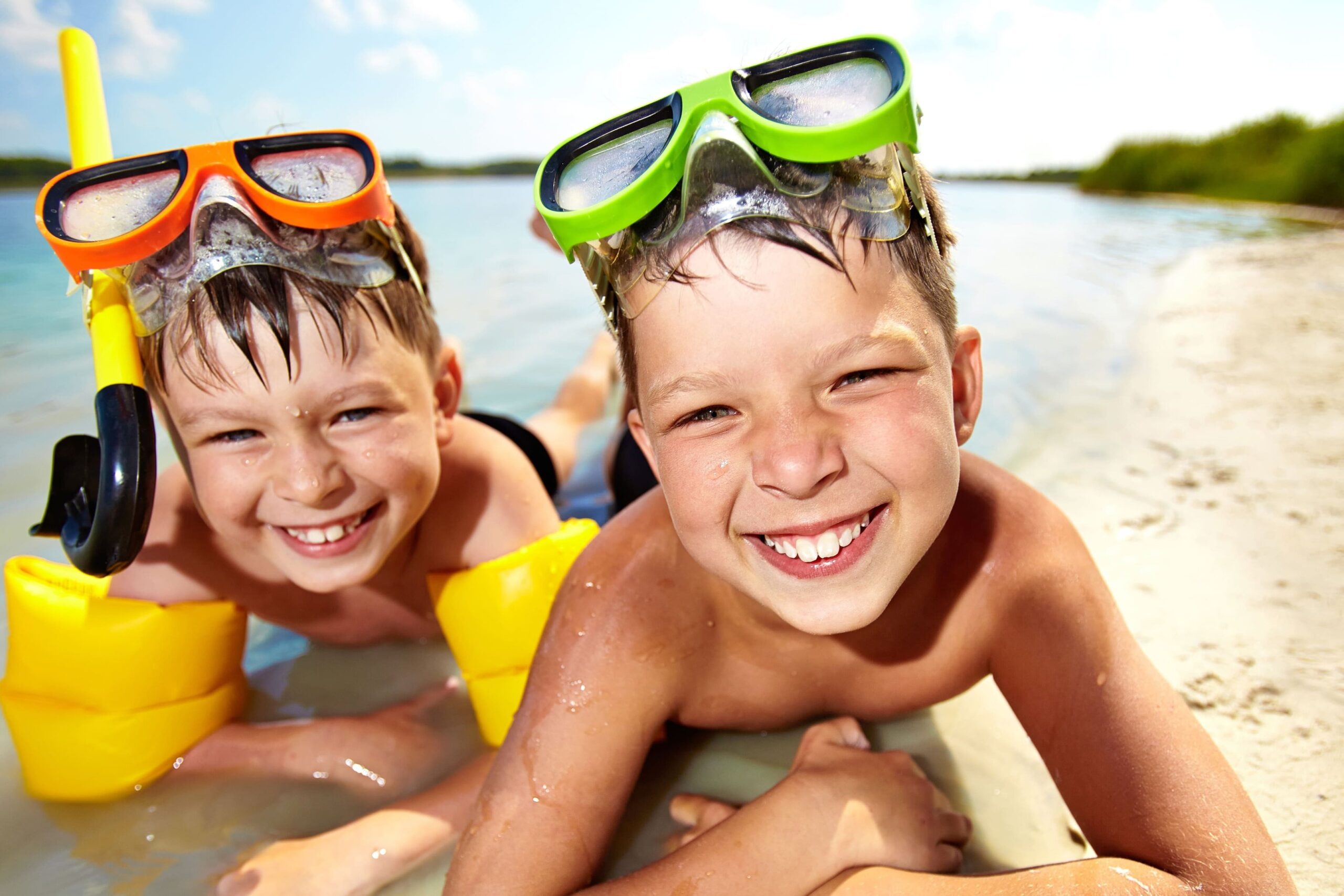 two boys in snorly goggles and snorkers